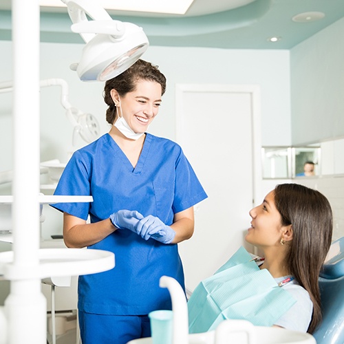  Patient in Fort Myers talking to dentist about cosmetic dental bonding