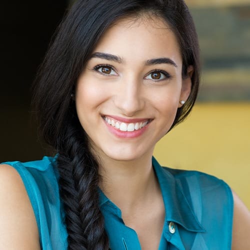 Woman smiling after gum recontouring treatment