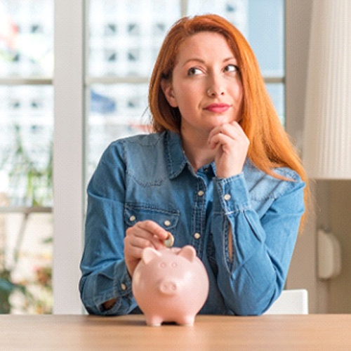 Woman saving for cosmetic dentistry in Fort Myers