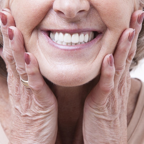 Closeup of woman smiling with dentures in Fort Myers