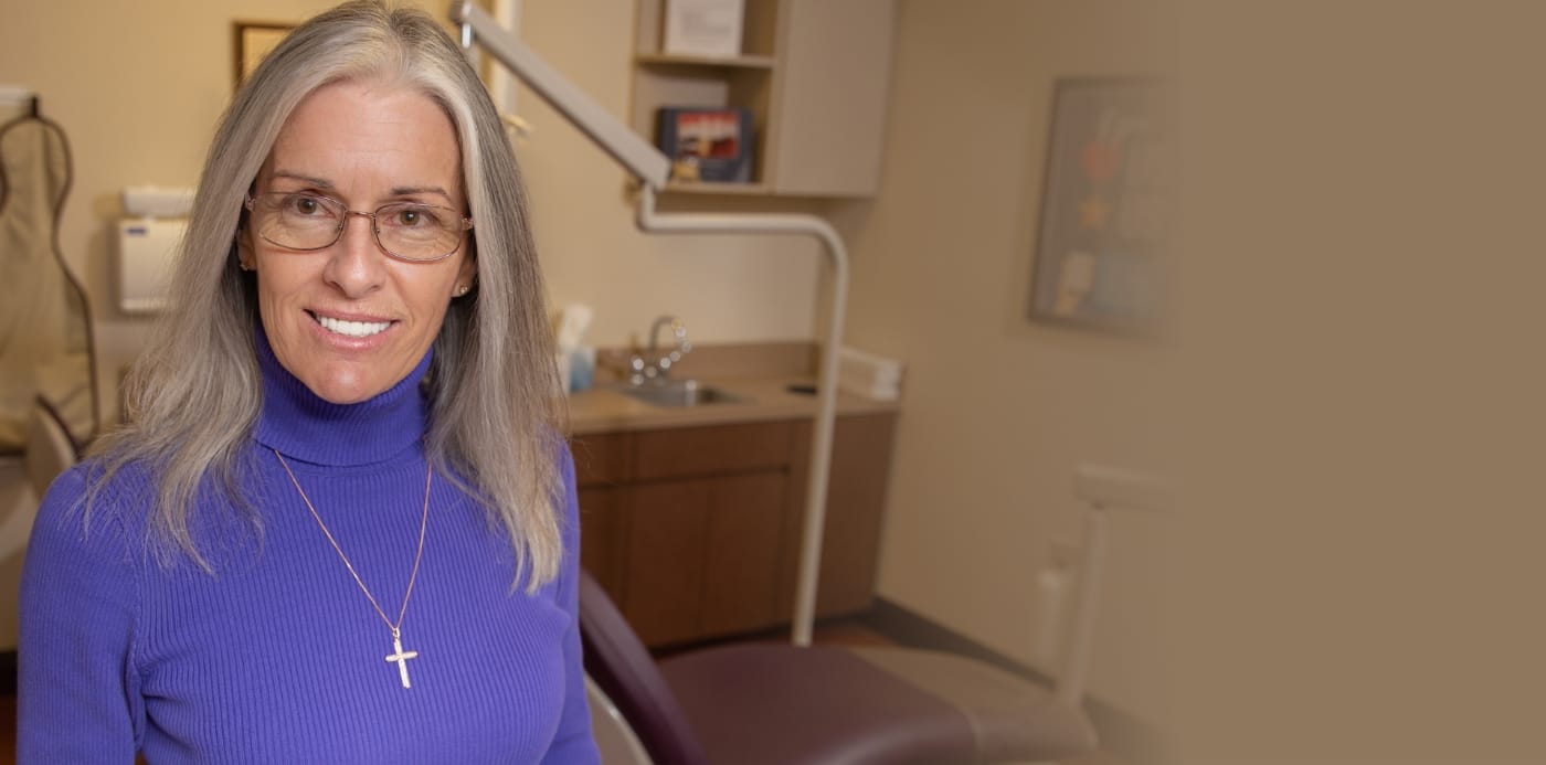 Dental patient Joanne K smiling after full mouth reconstruction