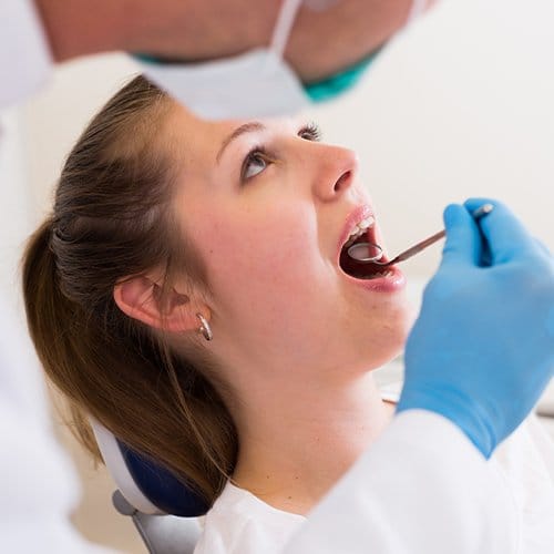 Patient receiving oral cancer screening