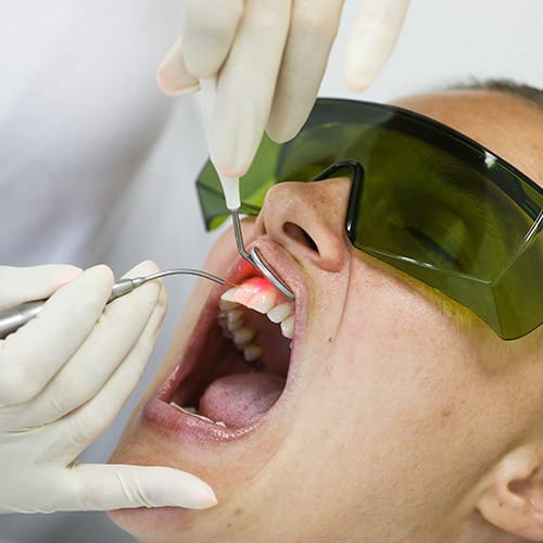 Patient receiving diode laser dentistry treatment