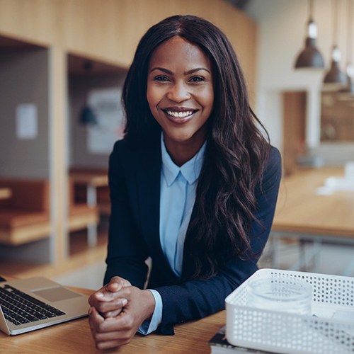 Businesswoman smiling with veneers in Fort Myers