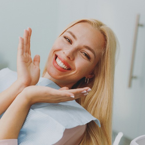 Blonde woman showing off smile after teeth whitening in Fort Myers, FL
