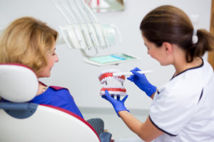 Fort Myers dentist and patient discussing oral health habits