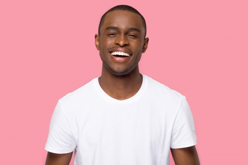 person with porcelain veneers smiling