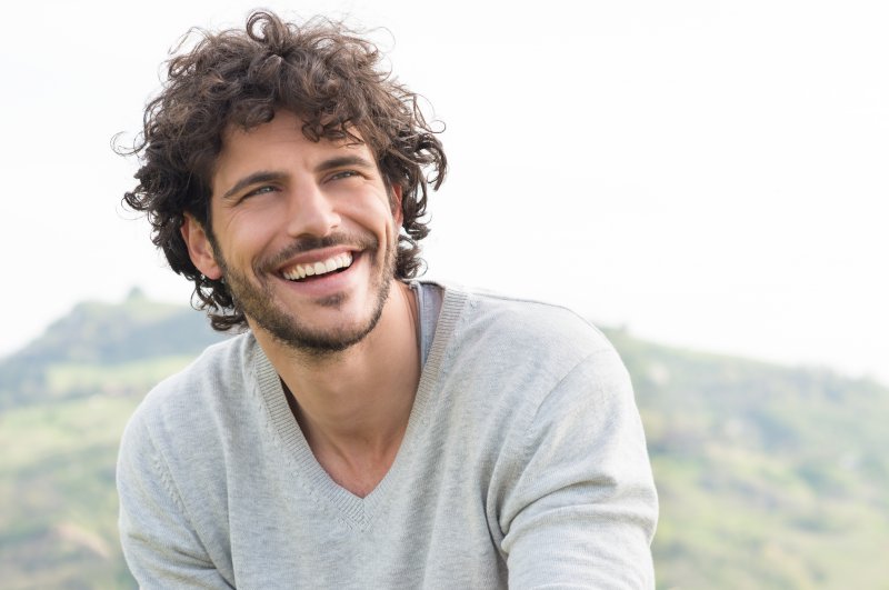 Man experiencing the benefits of smiling
