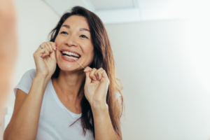 a person using dental floss